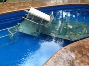 wind blew furniture into fiberglass pool